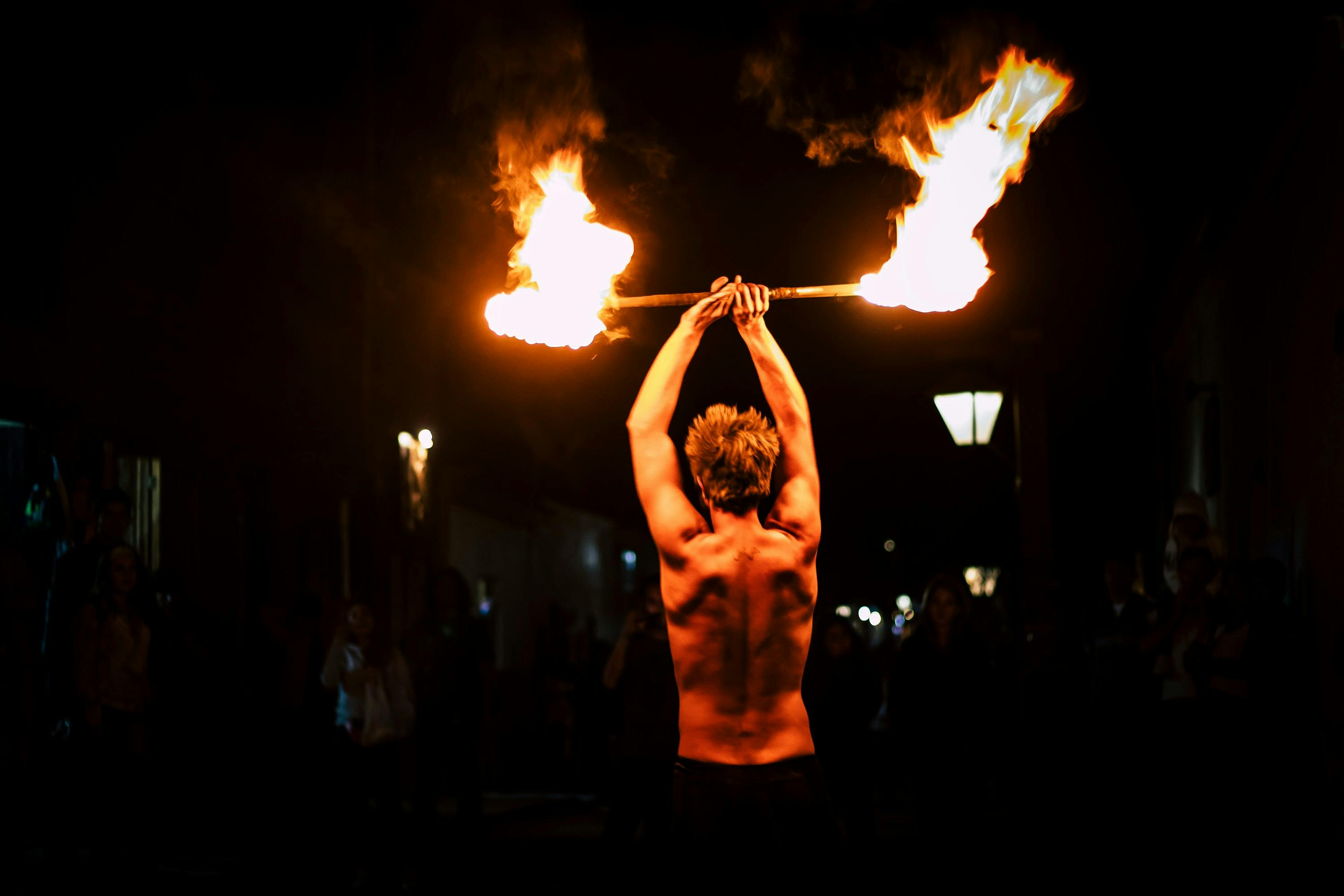 Alex Taylor performing with fire